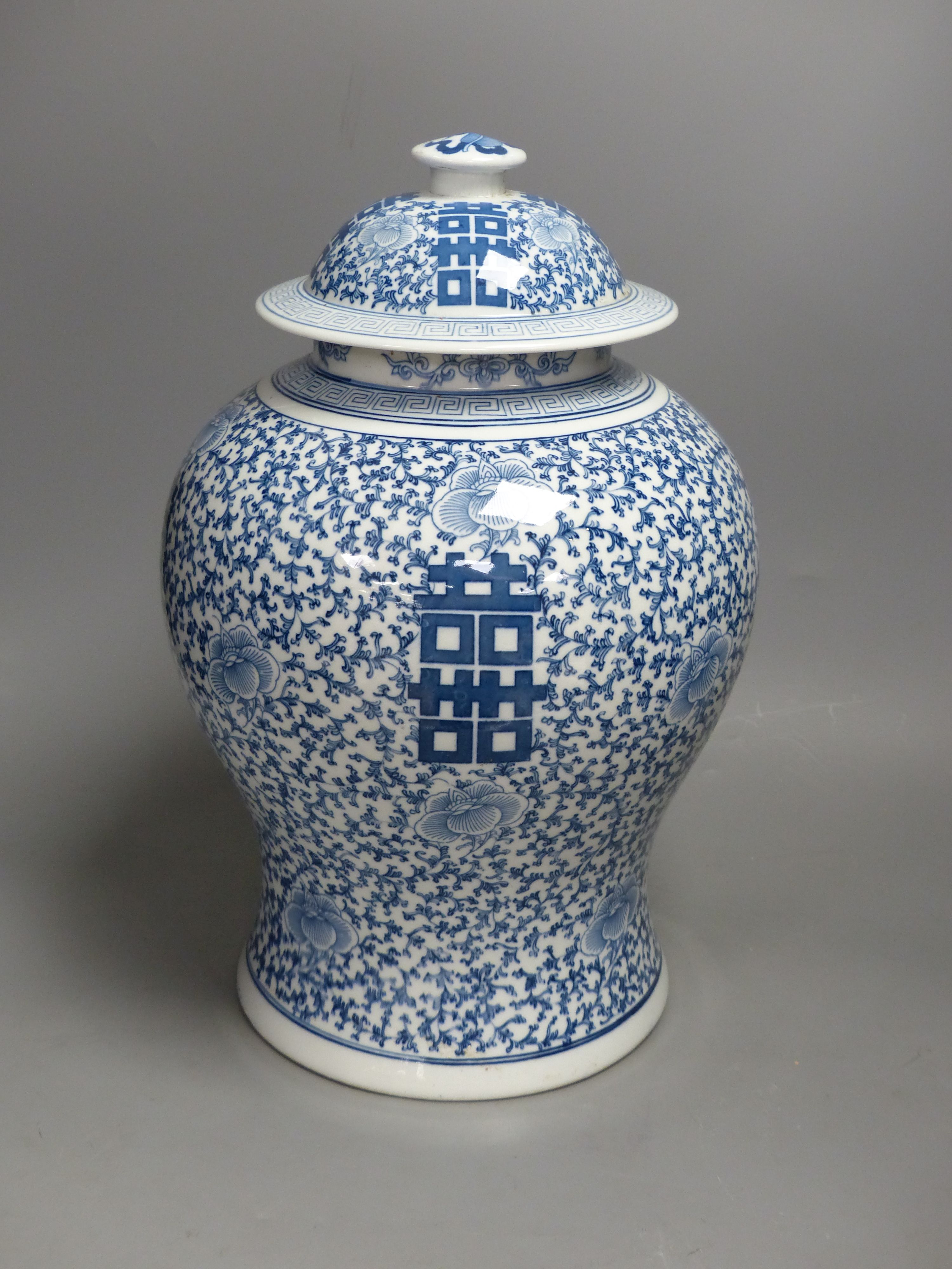 A large 20th century Chinese blue and white Shuangxi baluster vase and cover, height 32cm